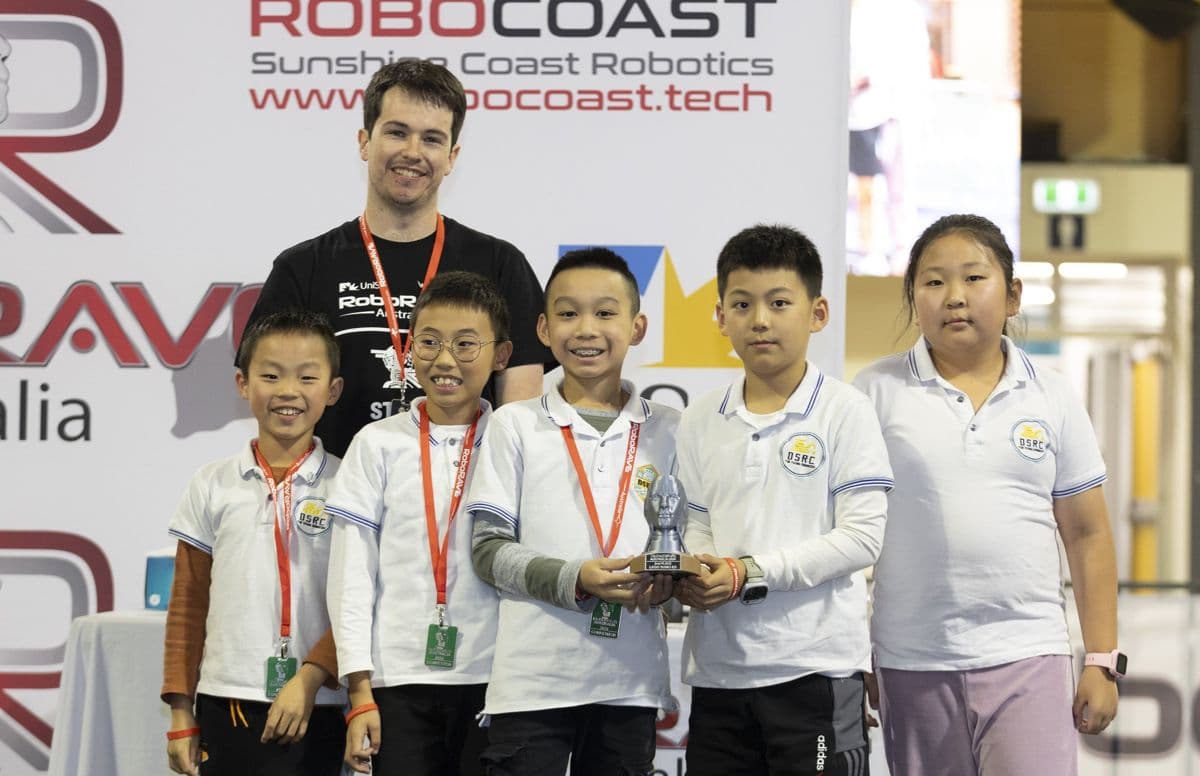 A team with their trophy at the 2024 awards ceremony